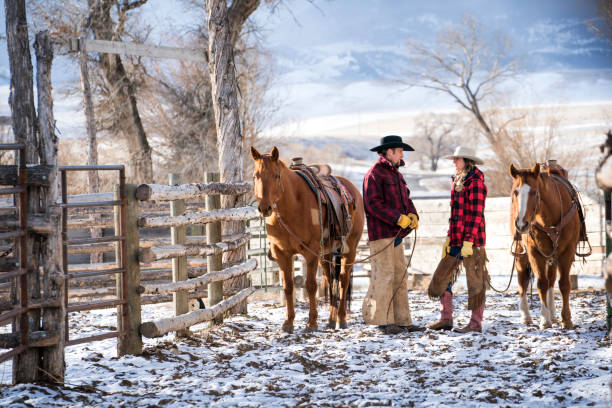 istock Ranchers and their horses on a Montana ranch in winter 952073694