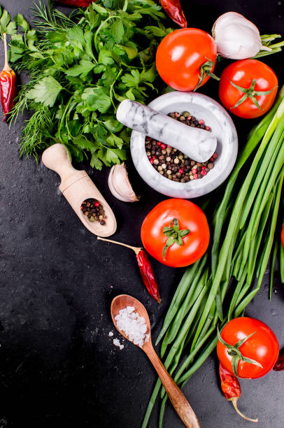 istock cherry tomatoes on a branch, oil,  parsley and spice 952080044