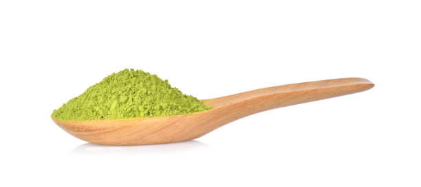 istock powder green tea on wooden spoon isolated on white 952080292