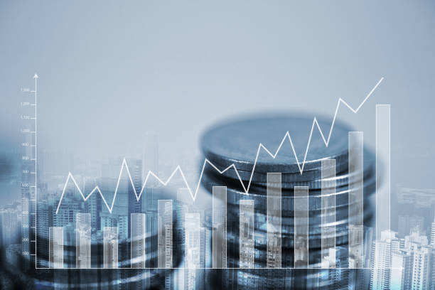istock Double exposure Stack of coin with financial graph over city and office building background, business and financial concept. 952083092