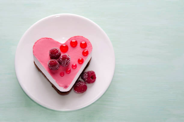 istock nice small cake in the form of heart  on the table 952088086