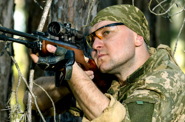 istock young man with an air rifle 952089490