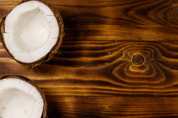 istock Fresh ripe coconut on rustic wooden table 952089954