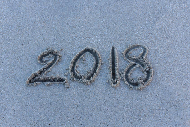 istock Number 2018 years on sand at the beach. 952090076