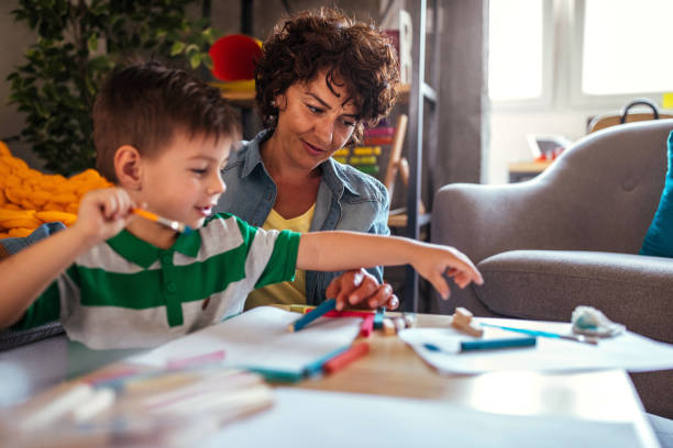 istock Mother and son coloring together 952090220