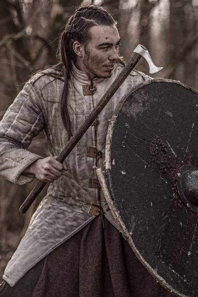 istock Weapon wielding bloody viking warrior alone in a winter forest 952092530
