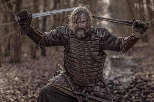 istock Weapon wielding bloody viking warrior alone in a winter forest 952092810