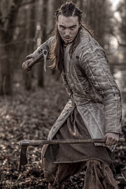 istock Weapon wielding bloody viking warrior alone in a winter forest 952092814