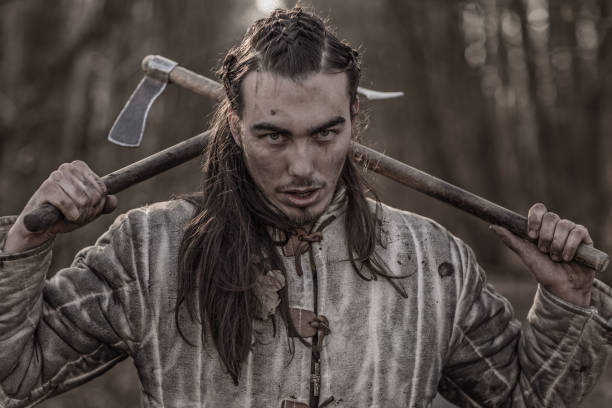 istock Weapon wielding bloody viking warrior alone in a winter forest 952092908