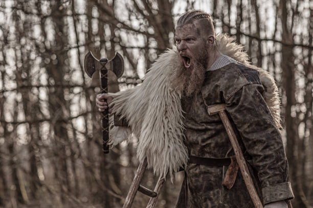 istock Weapon wielding bloody viking warrior alone in a winter forest 952092932
