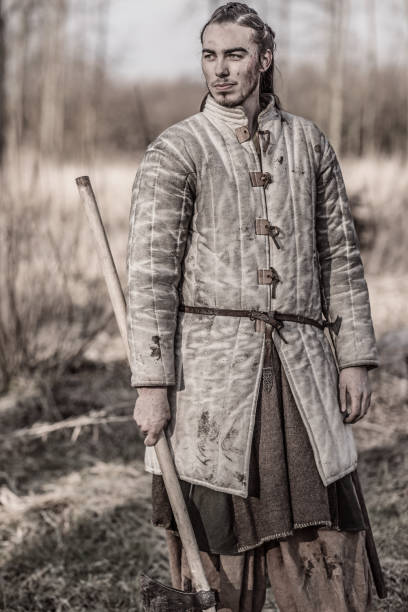 istock Weapon wielding bloody viking warrior alone in a winter forest 952093896