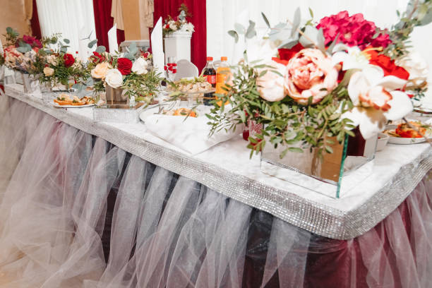 istock Classic and elegant wedding presidium and tables decor with blue cloth and bright blue and green flowers 952099104