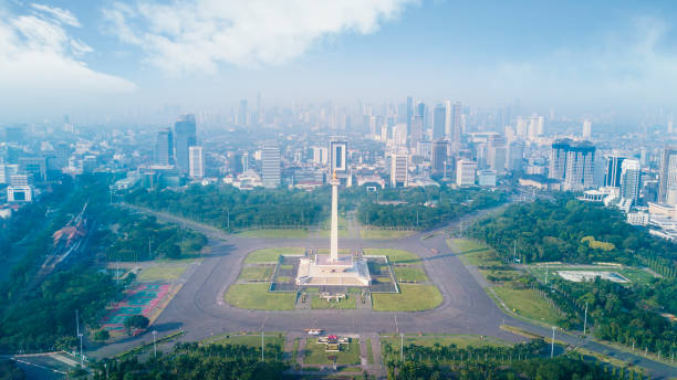 Famous National Monument in the downtown Jakarta, Indonesia. February 22, 2018: famous building of National Monument in the downtown merdeka square stock pictures, royalty-free photos & images