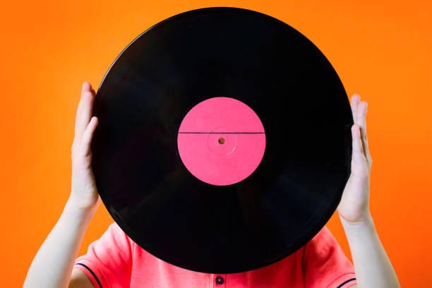 istock hands hold an old musical gramophone record 952100576