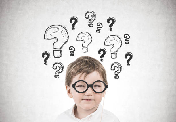 istock Cute little boy with glasses, questions 952100602
