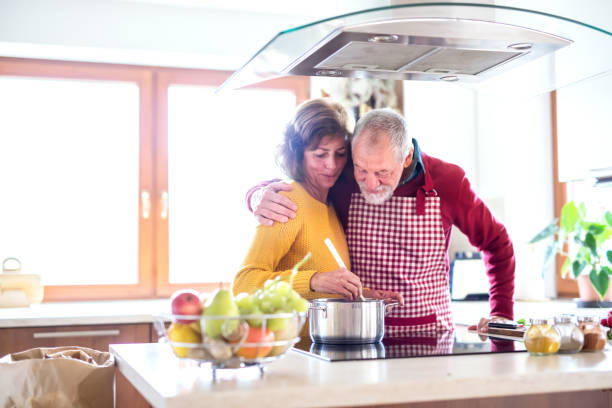 istock Senior couple preparing food in the kitchen. 952102656