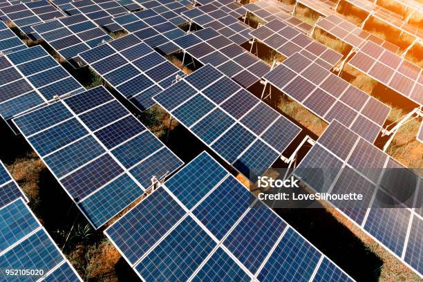 Sunset Over Solar Farm Stock Photo - Download Image Now - Solar Panel, Solar Energy, Climate