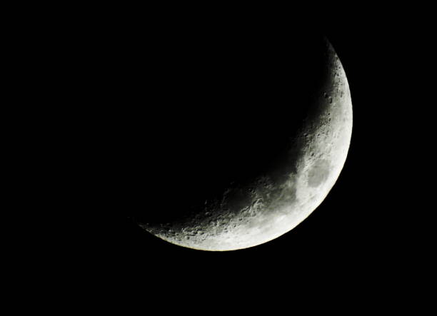 April crescent moon Beautiful crescent moon on a dark night in April planetary moon photos stock pictures, royalty-free photos & images