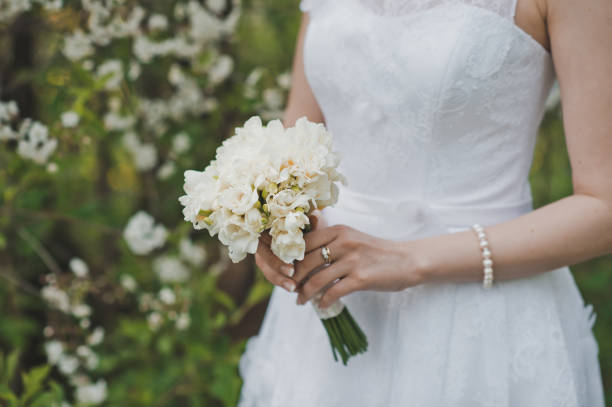 istock Bunch of flowers in hands 1285. 952111084