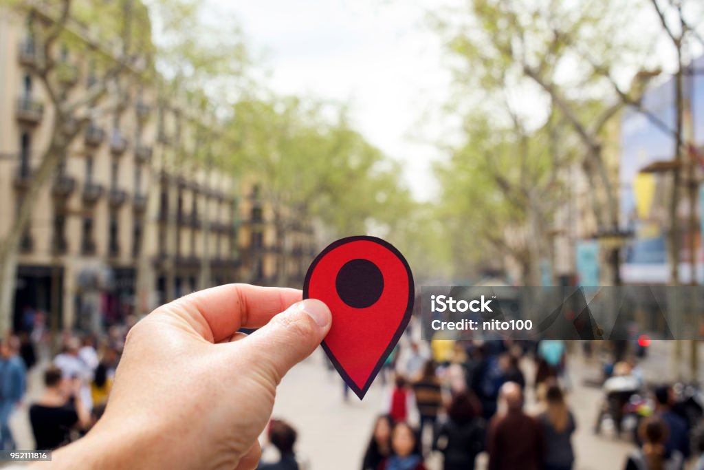 man with a red marker in Las Ramblas, Barcelona closeup of the hand of a young caucasian man with a red marker in the popular Las Ramblas, Barcelona, Spain Direction Stock Photo