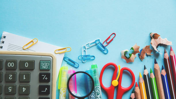 istock Different school or office supplies on a blue background. Education or business concept. Empty place for text. Flat lay. 952113038