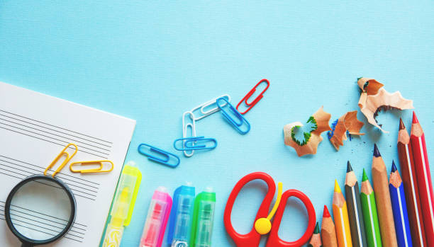 istock Different school or office supplies on a blue background. Education or business concept. Flat lay. 952113046