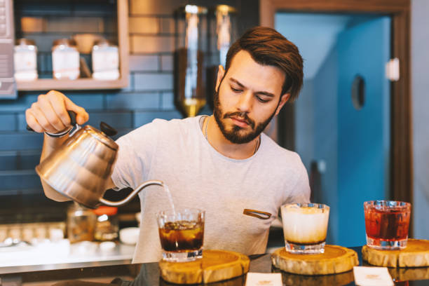 istock Young barista is making a cold coffee in cafe shop 952114392
