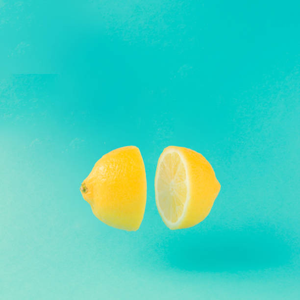 istock Lemon cut in half on pastel blue background. Minimal summer concept. Flat lay. 952114702