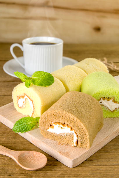 istock Swiss roll on wooden table 952117116