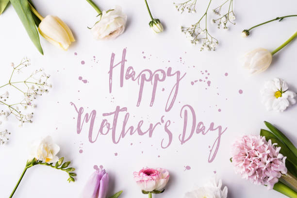 istock Happy mothers day composition. Flowers on white background. Studio shot. 952117240