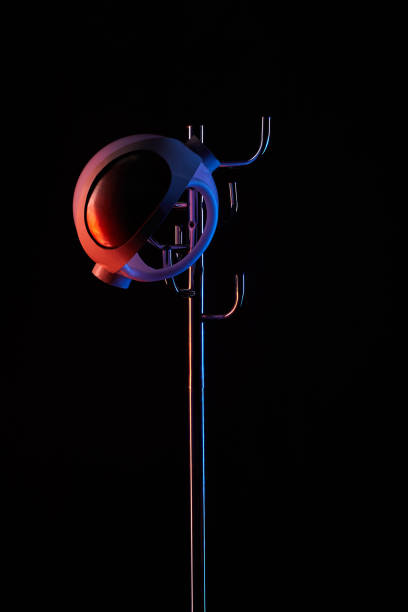 istock astronaut helmet on coat rack under toned light isolated on black 952117250