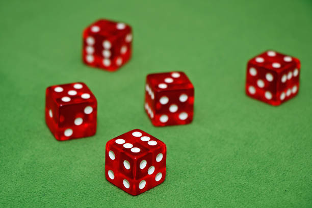 istock Red dices of a casino on a green table 952120696