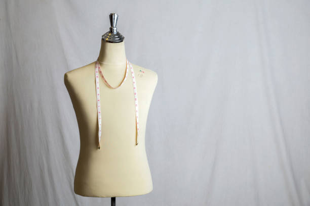 istock Pins on Mannequin with measuring line on white background. 952121600
