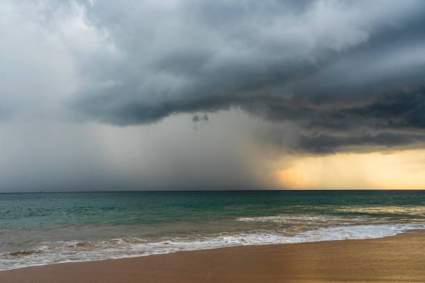 Dramatic thunderstorm clouds in the sky over the ocean.