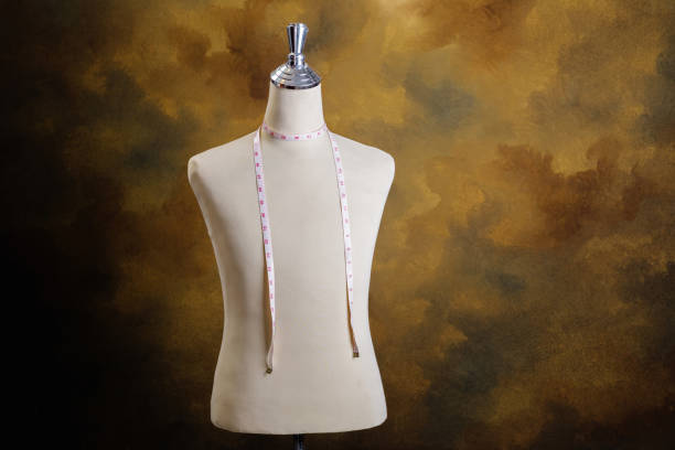 istock Mannequin with measuring line on brown background 952124026