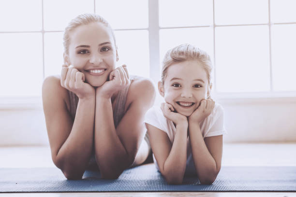 istock Mother and daughter doing sport 952126798
