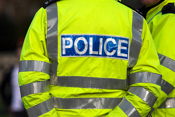 istock Back view of a police officer in reflexive jacket 95212739