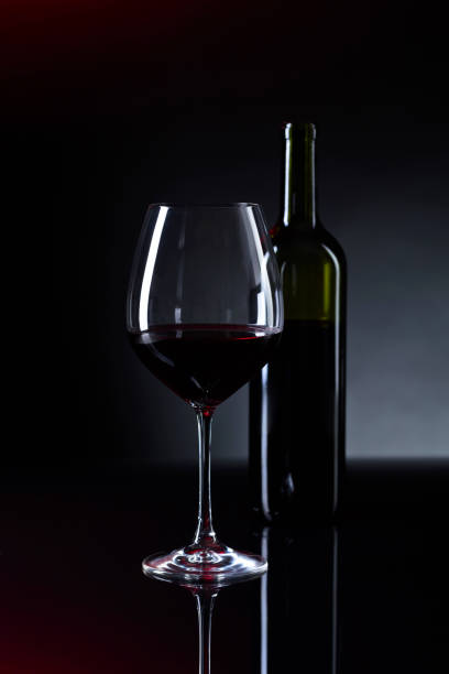 istock Glass and bottle of red wine. 952188048
