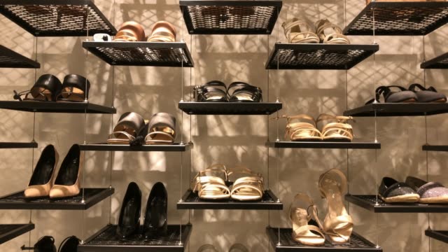 shelf of shoes in retail store at shopping mall