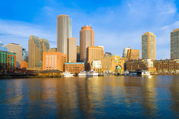 boston financial district skyline and harbor at dawn - boston skyline harbor city imagens e fotografias de stock