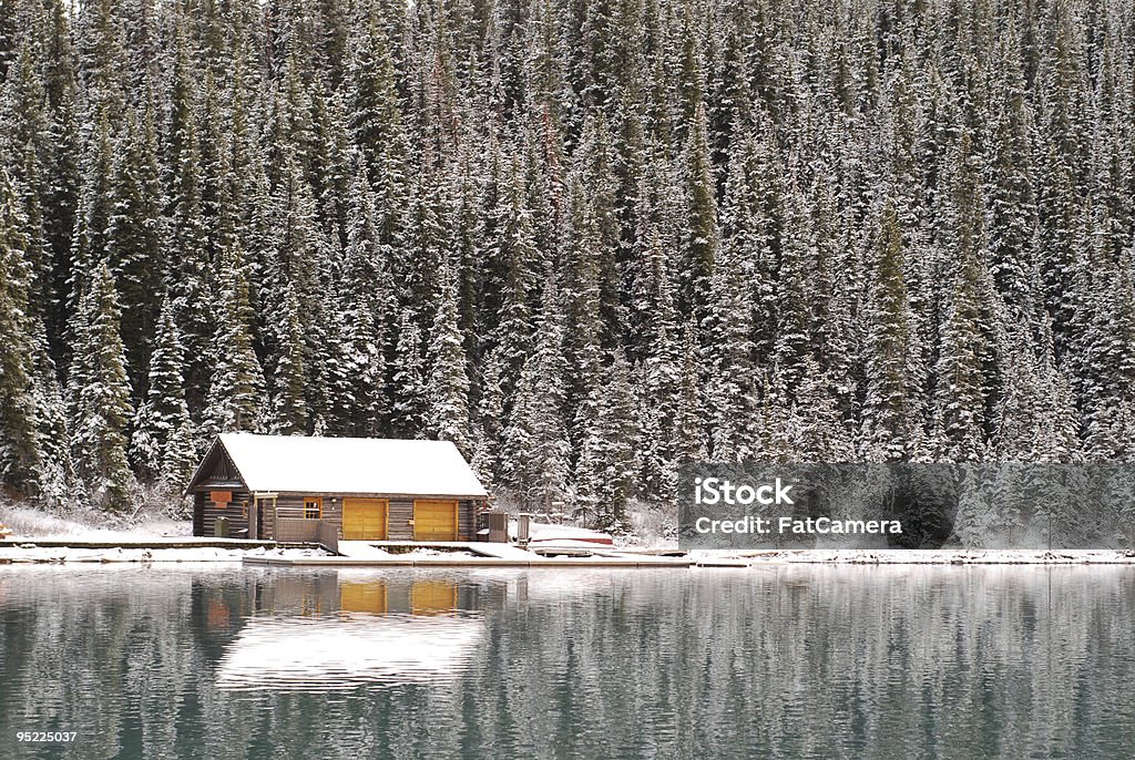 Winter Cabin A generic cabin by a lake in winter. Cottage Stock Photo