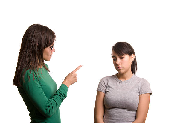 In Trouble An older sister or young teacher scolding a teen girl. teasing stock pictures, royalty-free photos & images