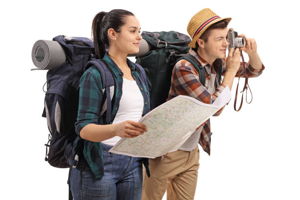 istock Teenage tourists with a map and a camera 952296888