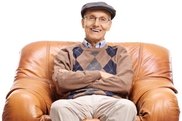 istock Senior seated in a leather armchair smiling 952299696