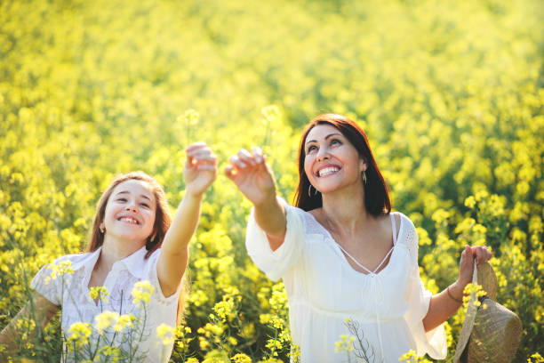 istock Mother and daughter on sunny meadow 952302936