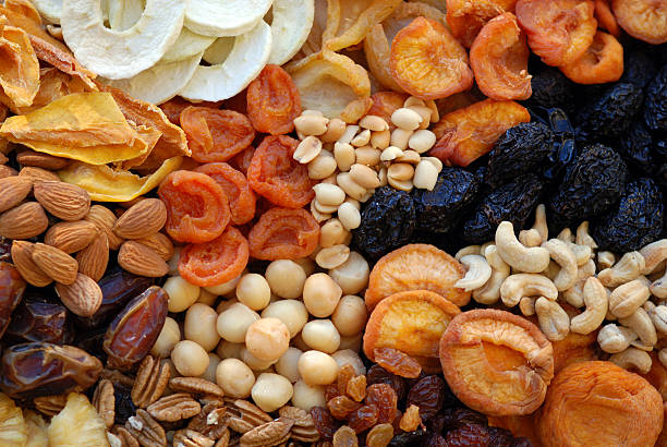 Healthy sundried organic Fruit & Nuts  dried fruit stock pictures, royalty-free photos & images