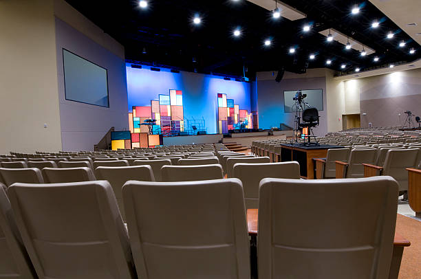 Church with Blue Lit Stage  place of worship photos stock pictures, royalty-free photos & images