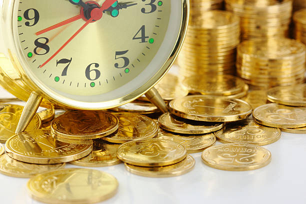 istock Clock and coins, time is money concept 95231718