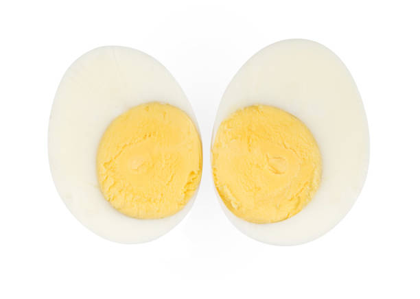 istock Boiled egg sliced two piece isolated on white background on top view 952319262