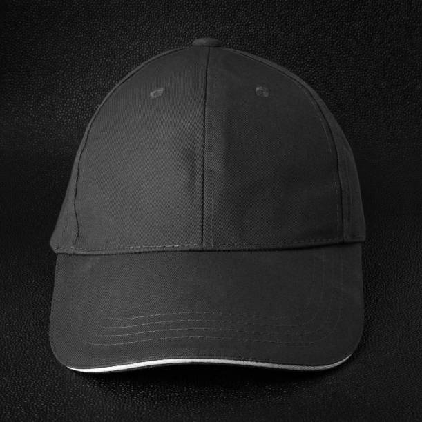 istock Black cap dark background. Template of baseball cap in front view. 952323444